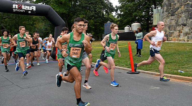 A group of Delaware Tech Cross Country Runners participating in the Hometown Heroes 5K